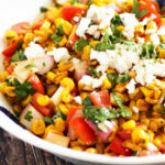 corn salad with tomato, feta, and cilantro