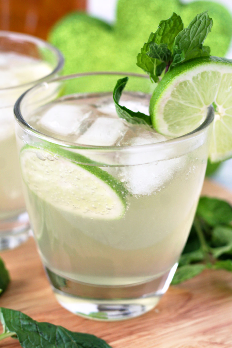 Close up of Irish Mule Cocktail garnished with lime slices and fresh mint.