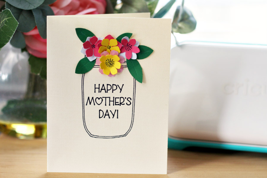 3D Mother's Day Card next to a vase of flowers and the Cricut Joy.