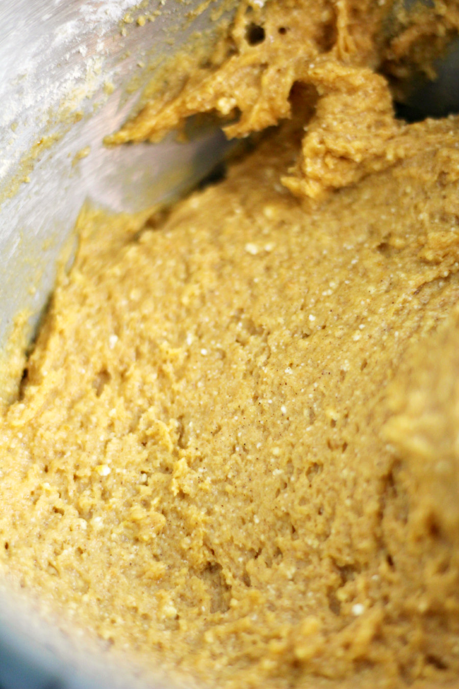 Pumpkin Spice Ricotta Cake ingredients mixed together in a metal mixing bowl.